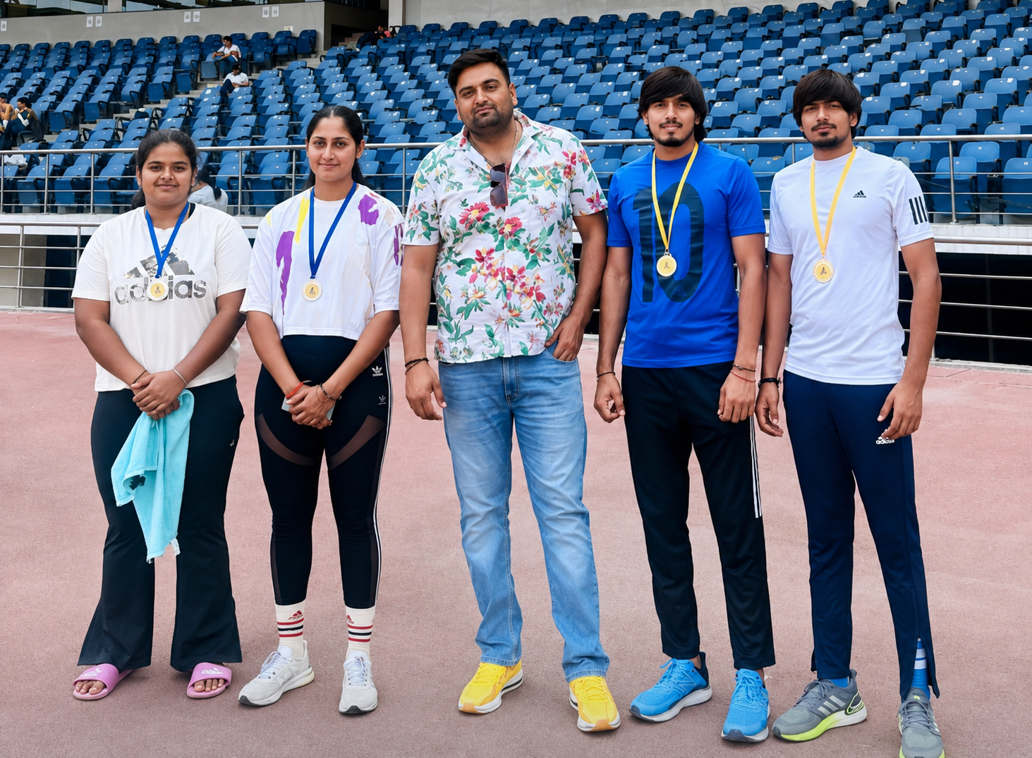 Athletics Heroes athletes and coach at an athletics stadium